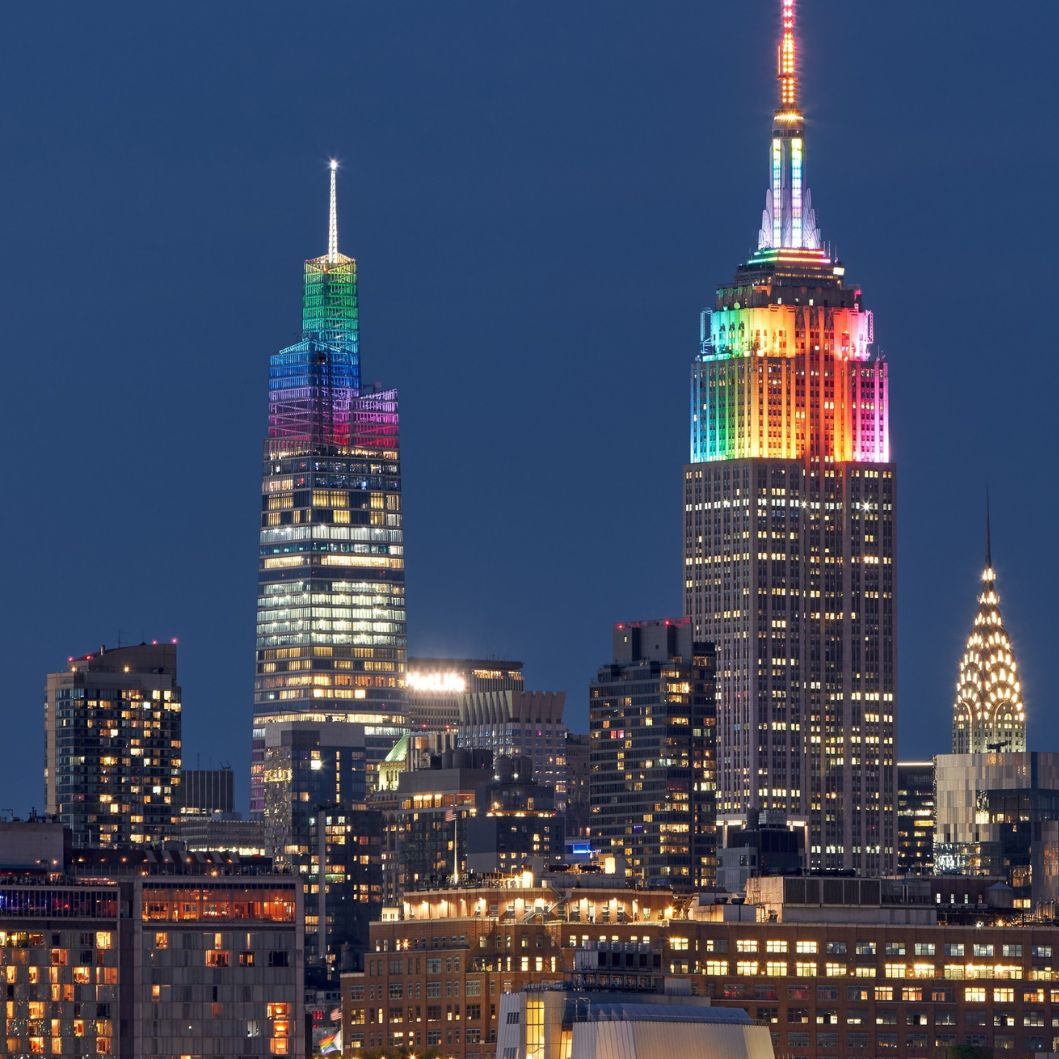 City skyline at night with colorful lights on skyscrapers